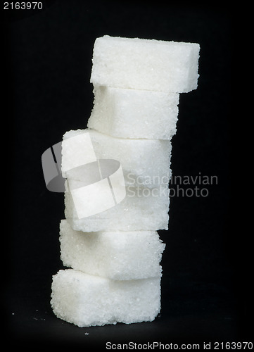 Image of Sugar lumps black isolated