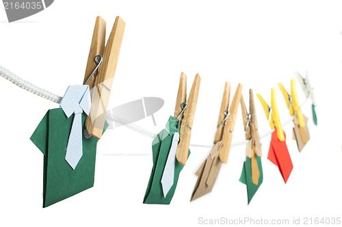 Image of Origami shirts on rope