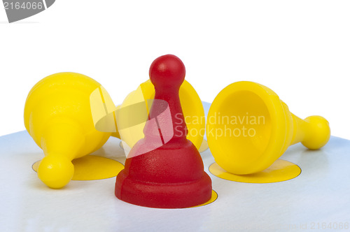 Image of Red and yellow game pawns white isolated
