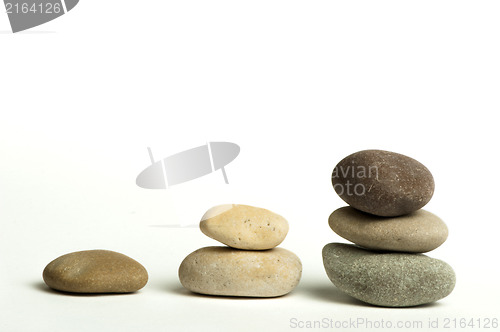 Image of Stacked stones white isolated