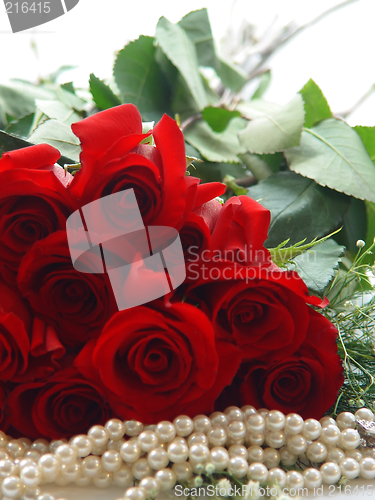 Image of Closeup of a Dozen Roses and Pearls