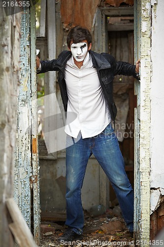 Image of Guy mime against the old wooden door.