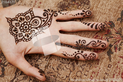 Image of Henna art on woman's hand