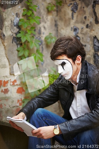Image of Mime guy reads his book