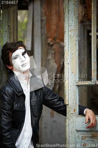 Image of Guy mime against the old wooden door.