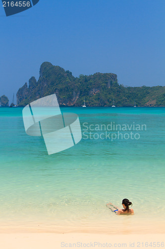 Image of Young womand relaxing at the beach