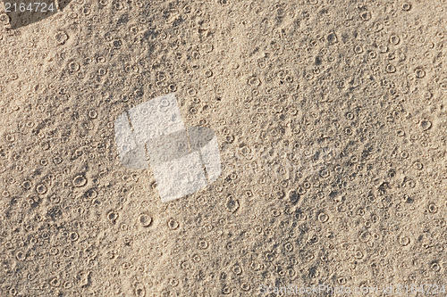 Image of Tracks of rain on sand