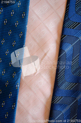 Image of cravat tie scarfs texture blue pink background 
