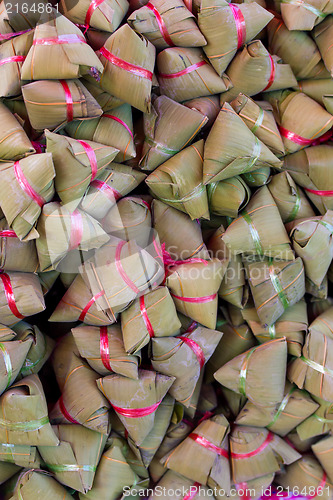 Image of steamed rice dough with sweet coconut stuffing. Thai dessert. al