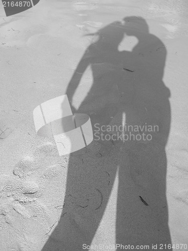 Image of Shadow of loving couple at the beach