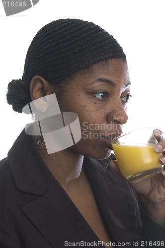 Image of woman drinking orange juice