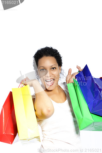 Image of Laughing woman with colourful shopping bags