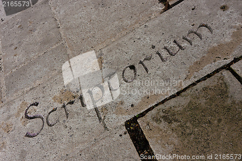 Image of Letters on a stone wall
