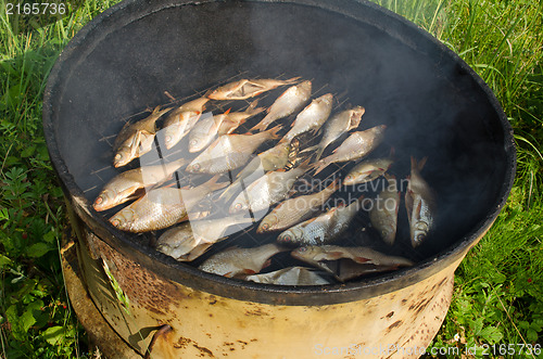 Image of ecologic fish smoke smoke house rusty barrel 