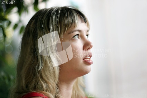 Image of Blond girl looking up