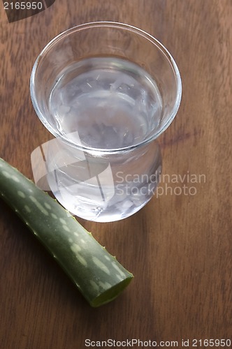 Image of aloe vera juice with fresh leaves