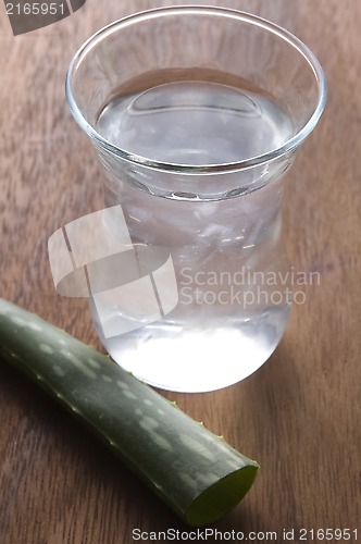 Image of aloe vera juice with fresh leaves