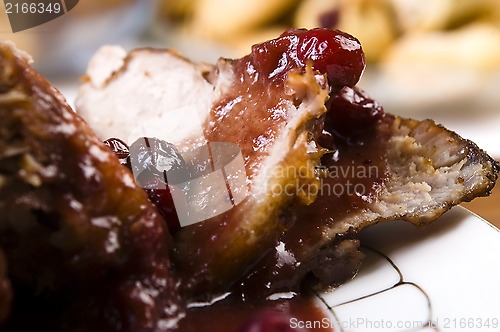 Image of Delicious Scrambled Grilled meat with cranberry sauce 