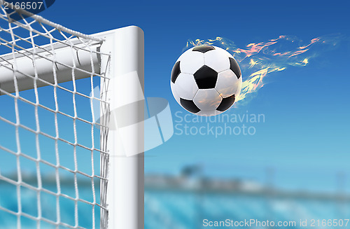 Image of football flies in goalkeeper gate