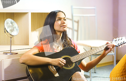 Image of lady with guitar