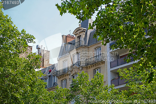 Image of Part of a house with an attic and balcony.