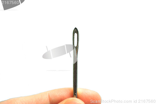 Image of Hand holding a Sewing needle