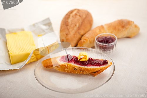 Image of bread butter and jam 