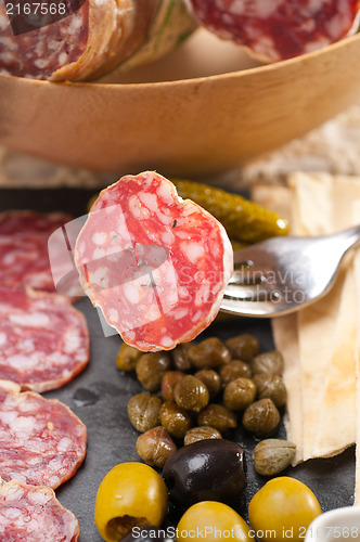 Image of cold cut platter with pita bread and pickles