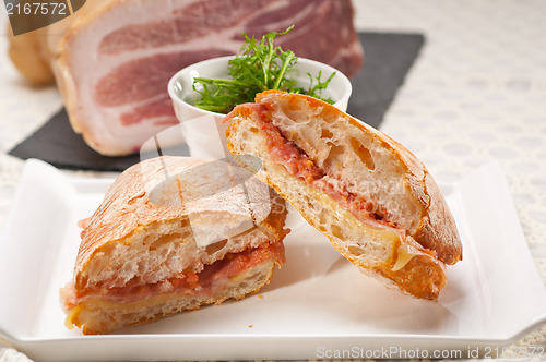 Image of ciabatta panini sandwich with parma ham and tomato