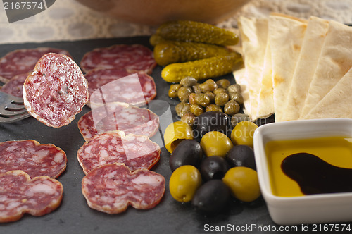 Image of cold cut platter with pita bread and pickles