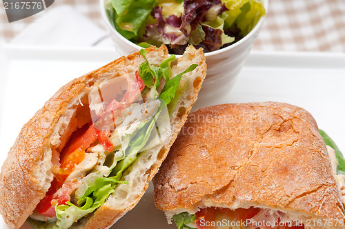 Image of ciabatta panini sandwich with chicken and tomato