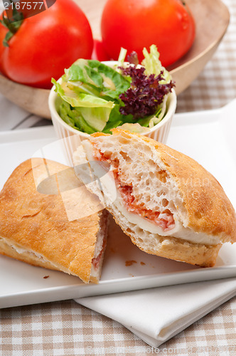 Image of ciabatta panini sandwich with parma ham and tomato