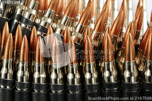 Image of chain of bullets over white, close-up