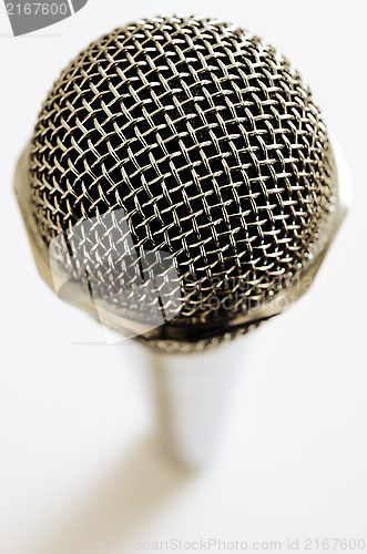 Image of vintage microphone over white