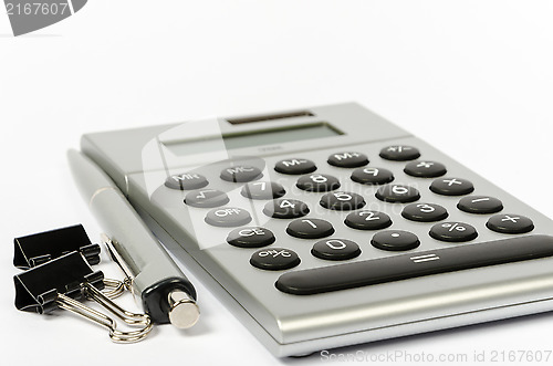 Image of A calculator and a pen on a white background