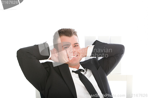 Image of Relaxed confident smiling businessman