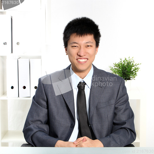 Image of Confident happy young Asian businessman