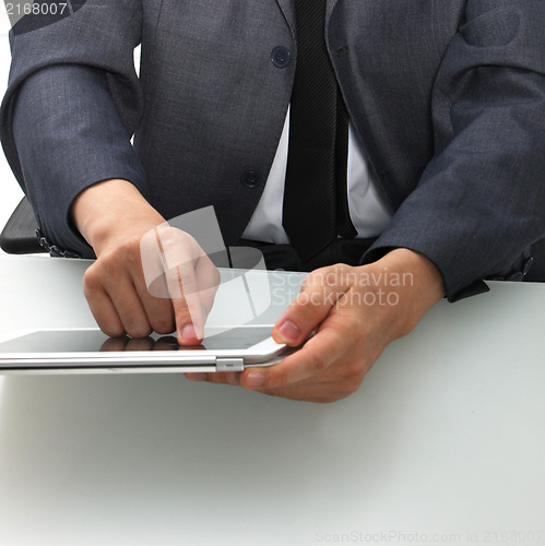 Image of Man using a tablet computer