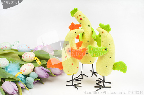 Image of Easter chicken family with tulips and eggs