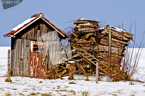 Image of Old cabin in snow