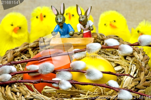 Image of easter basket with painted eggs, catkin, biddies and bunnies