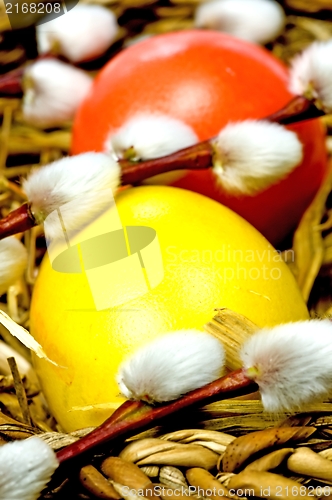 Image of easter basket with painted eggs and catkin 