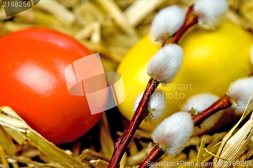 Image of easter basket with painted eggs and catkin 