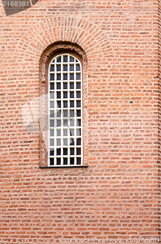 Image of A window and a texture of a wall with red bricks