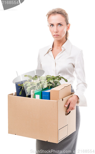 Image of Portrait of business woman holding a box with her belongings