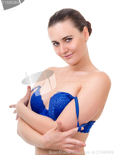 Image of young woman takes off bra