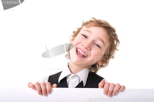 Image of Little boy is peeking from blank sign