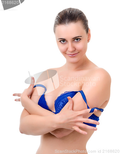 Image of young woman takes off bra