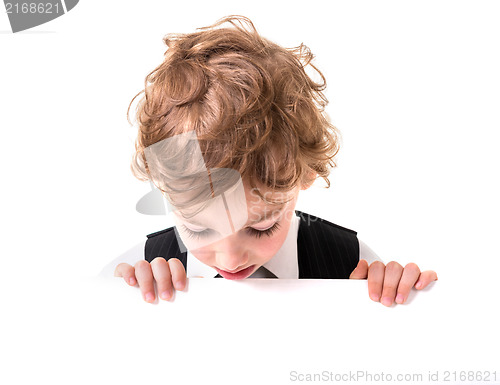 Image of Little boy is peeking from blank sign