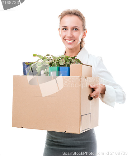 Image of Portrait of business woman holding a box with her belongings